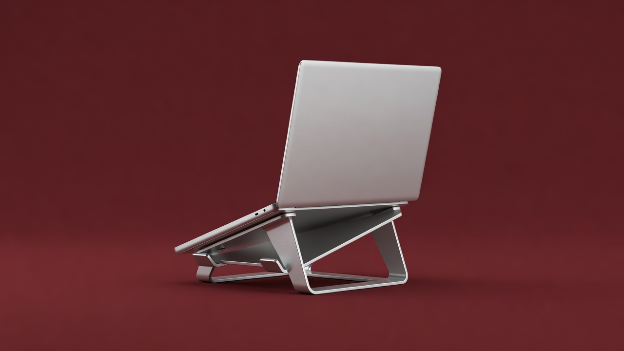 Aluminium laptop stand holding a laptop at eye level, soft-lit 3D render on a burgundy backdrop